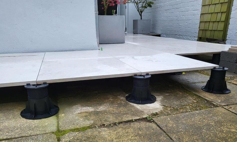 What is the Best Paving Pedestal to use? Self-Levelling vs Fixed Head