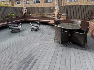 Natura-dark-brown-composite-decking-raised-seating-area-with-furniture